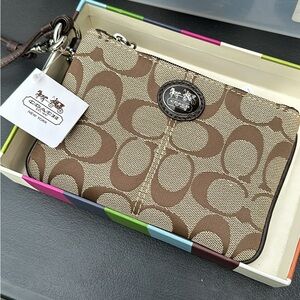 Brand new Coach wristlet